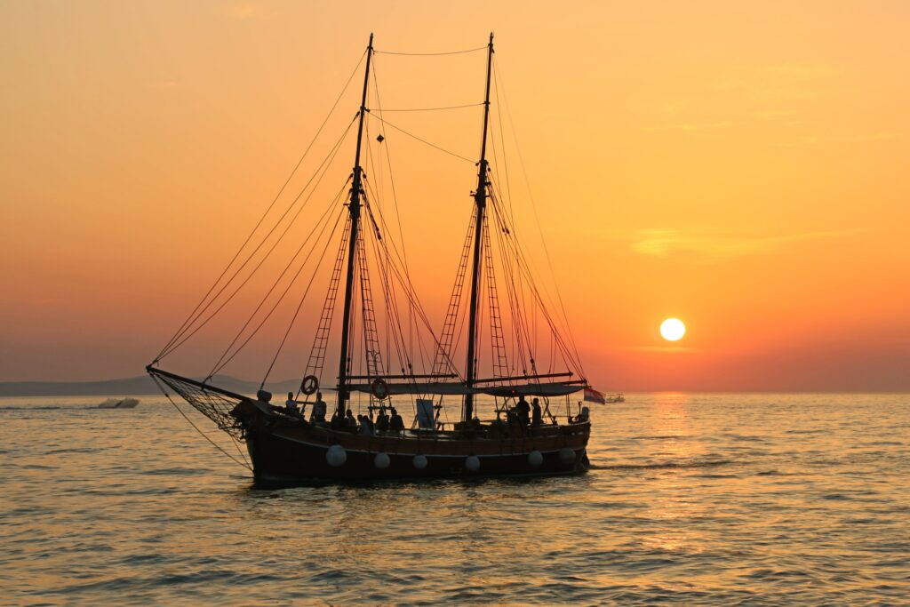 ship on horizon at sunset